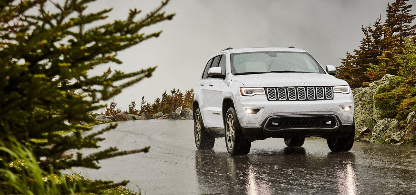 A jeep driving in the park - Used Cars Near Garden City